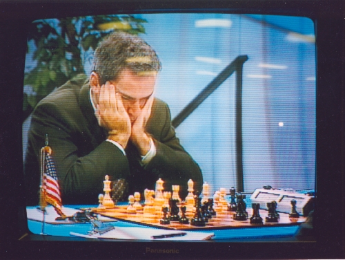 Garry Kasparov focuses intensely on his position in Game 6 of the Deep Blue vs Kasparov match in Philadelphia, Pennsylvania